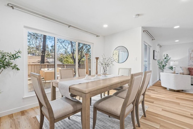 dining room with light hardwood / wood-style flooring