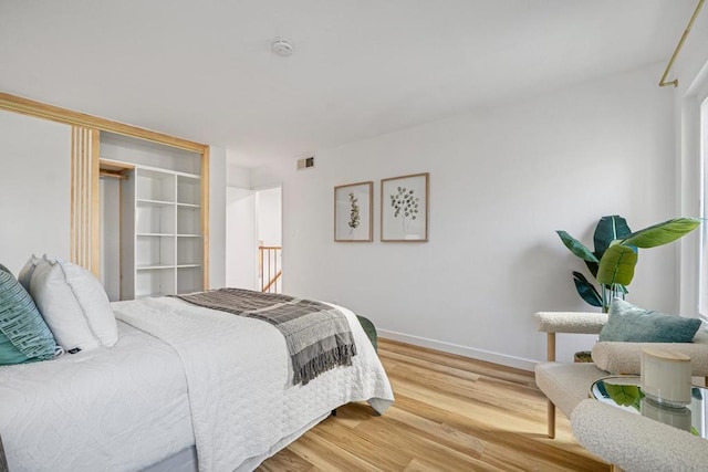 bedroom featuring wood-type flooring