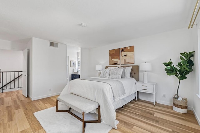 bedroom with light hardwood / wood-style flooring