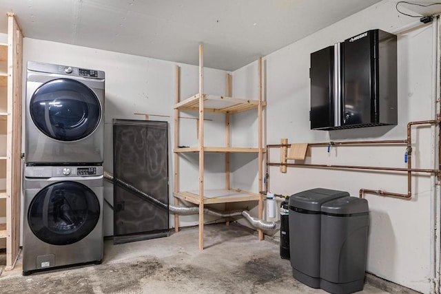 laundry room featuring stacked washing maching and dryer