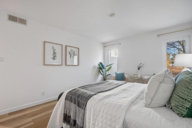 bedroom featuring hardwood / wood-style floors