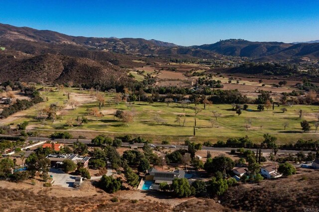 aerial view with a mountain view and a rural view