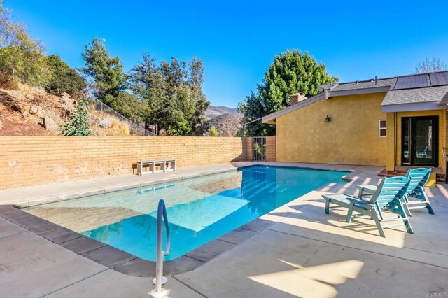 view of pool with a mountain view