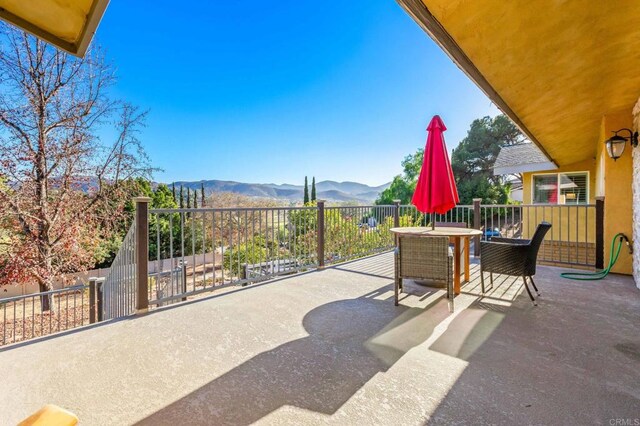 view of patio / terrace with a mountain view