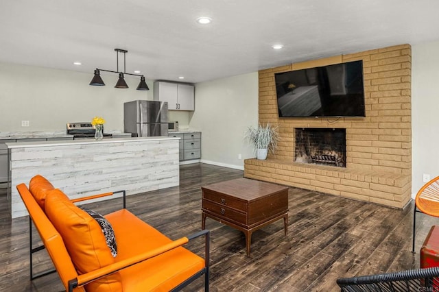 2846 Willow Glen Dr, El Cajon, CA 92019 - living area featuring dark wood finished floors, a fireplace, recessed lighting, and baseboards