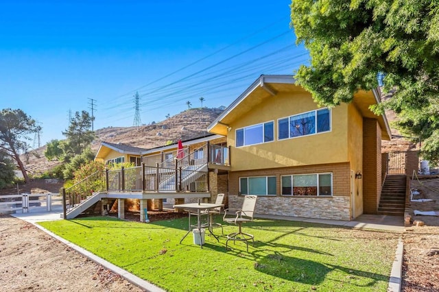 2846 Willow Glen Dr, El Cajon, CA 92019 - rear view of house with stairway, stone siding, stucco siding, and a wooden deck