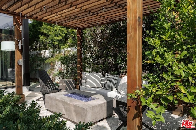 view of patio / terrace with a pergola and an outdoor fire pit