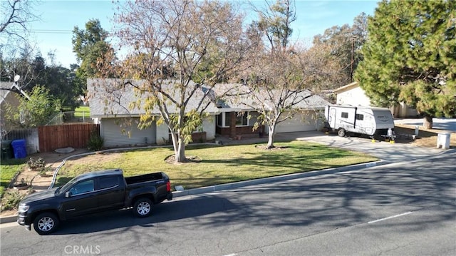 view of front of home with a garage and a front yard