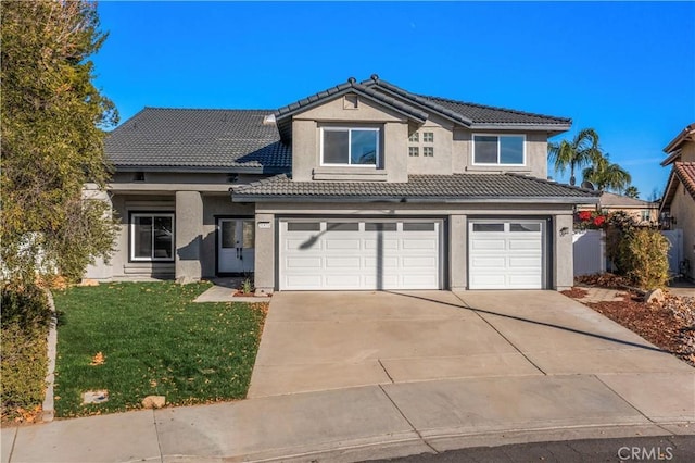 front of property featuring a front yard and a garage