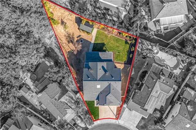 aerial view of property and surrounding area with property boundaries highlighted