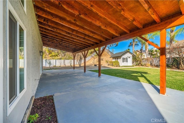 view of patio / terrace featuring a storage shed