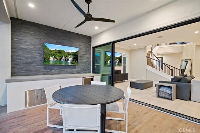 dining area featuring ceiling fan and light hardwood / wood-style flooring