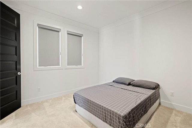 carpeted bedroom with crown molding