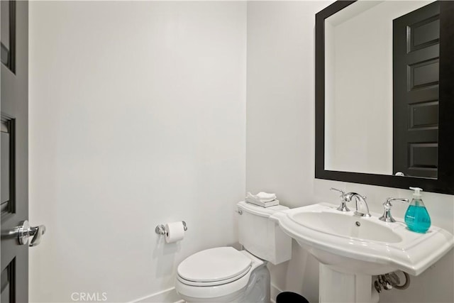 bathroom with sink and toilet