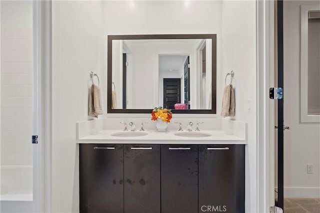 bathroom featuring tile patterned floors and vanity