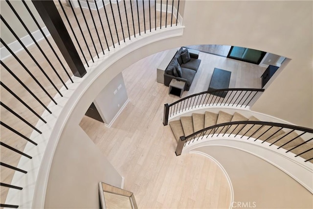 stairs featuring hardwood / wood-style flooring