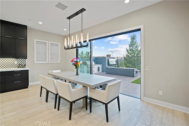 dining room with light hardwood / wood-style flooring