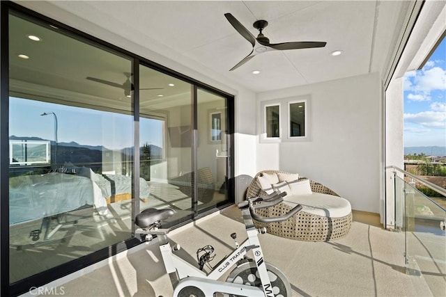 balcony with ceiling fan and a mountain view