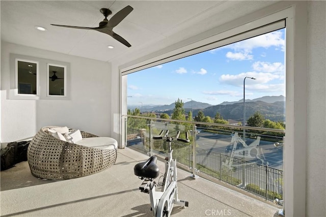 balcony with ceiling fan and a mountain view