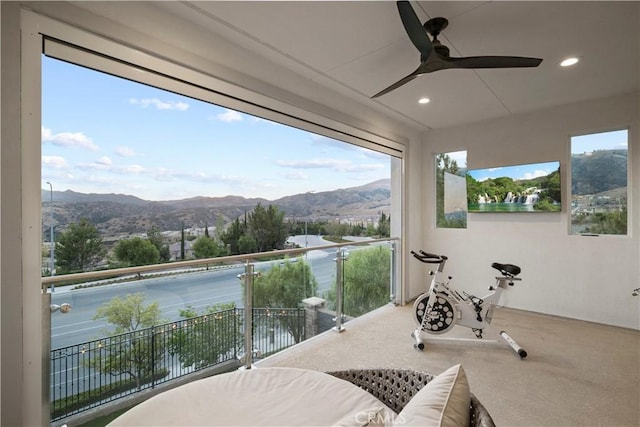 balcony with ceiling fan and a mountain view