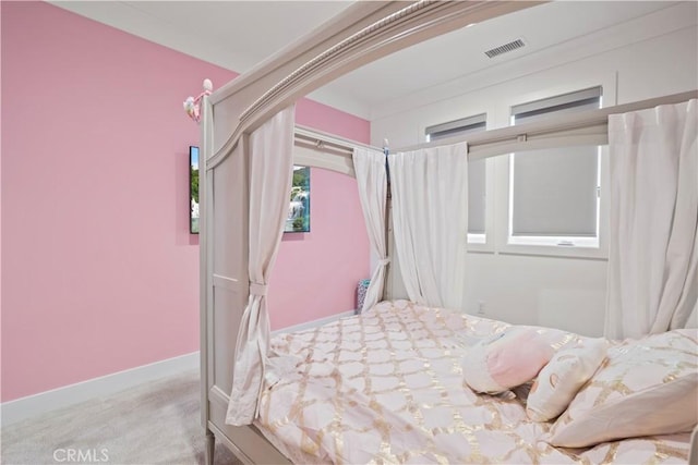 bedroom with light colored carpet