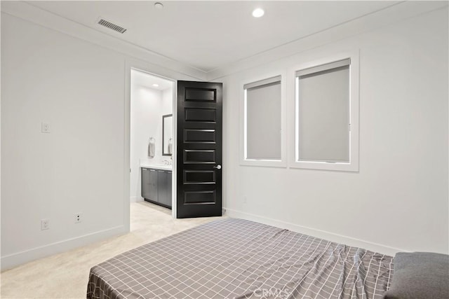 carpeted bedroom with crown molding