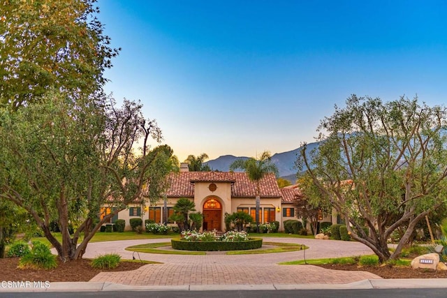 mediterranean / spanish home featuring a mountain view