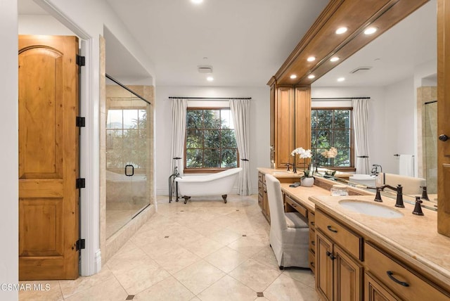 bathroom with vanity, tile patterned floors, a healthy amount of sunlight, and shower with separate bathtub