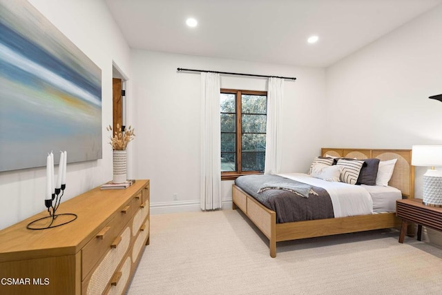 bedroom with light colored carpet