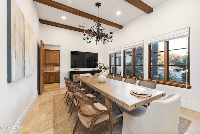 dining room with beam ceiling and a notable chandelier