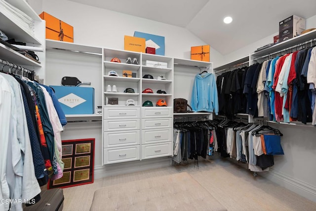 walk in closet featuring vaulted ceiling