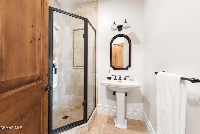 bathroom with tile patterned floors and walk in shower