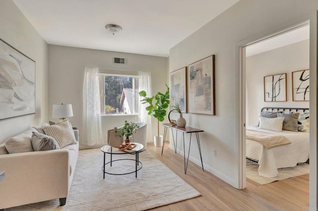 living area with light hardwood / wood-style floors