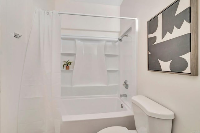 bathroom with toilet and shower / bath combo