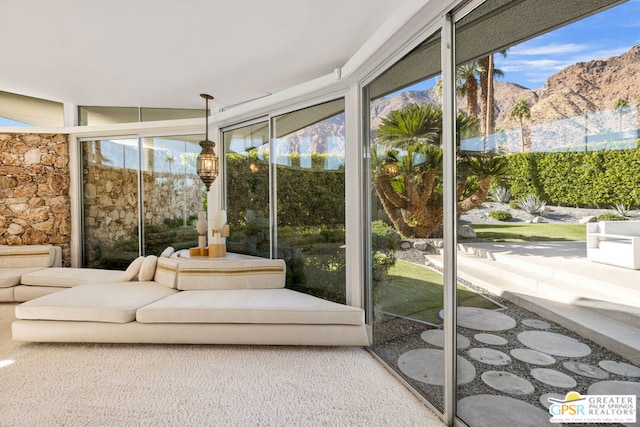 sunroom / solarium with a mountain view