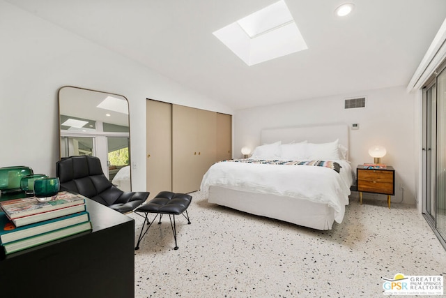 bedroom featuring lofted ceiling with skylight