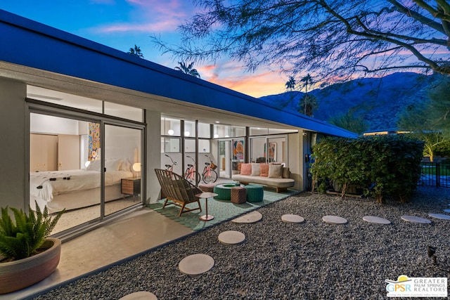 exterior space with an outdoor hangout area and a mountain view