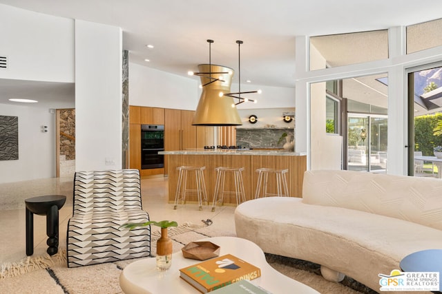 living room featuring light tile patterned flooring and an inviting chandelier