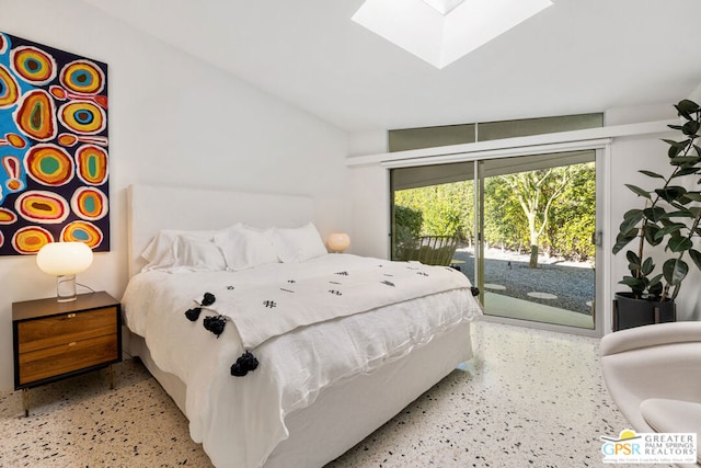 bedroom featuring a skylight and access to outside