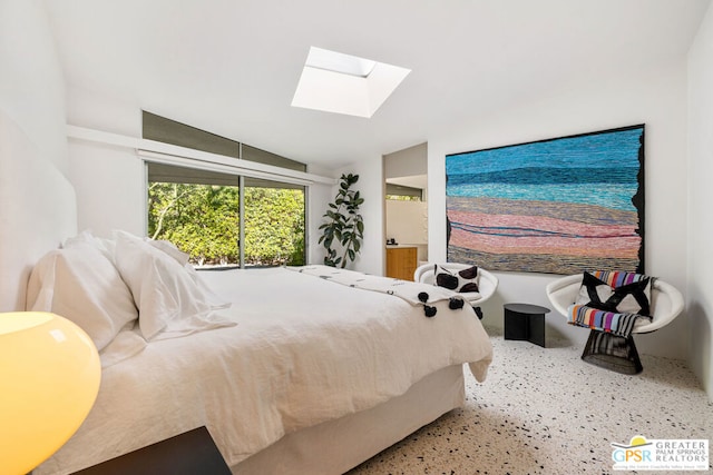 bedroom featuring lofted ceiling with skylight