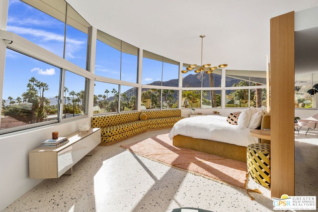 sunroom / solarium featuring a mountain view