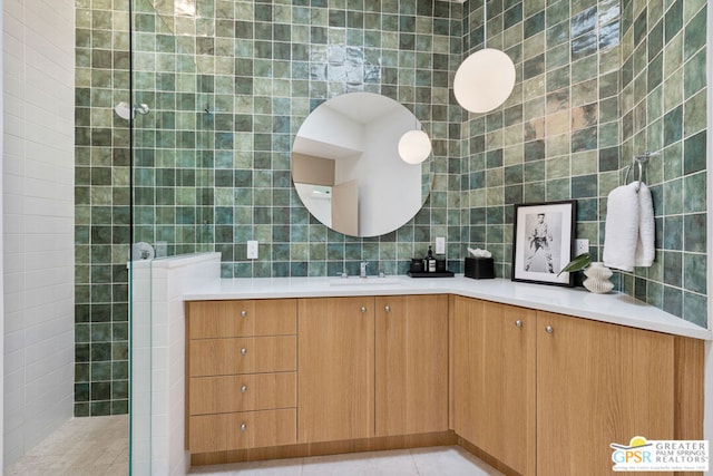 bathroom with tile walls, tile patterned floors, and vanity