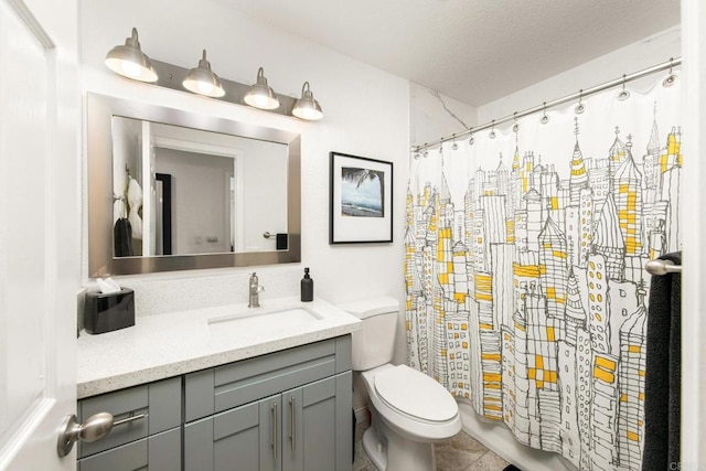 bathroom with toilet, vanity, and curtained shower