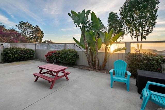 view of patio terrace at dusk