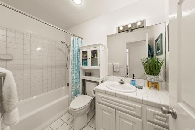 full bathroom featuring toilet, vanity, tile patterned flooring, and shower / bath combo with shower curtain