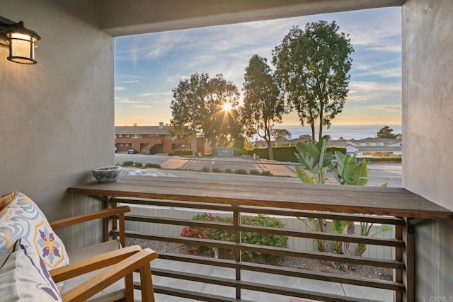 view of balcony at dusk