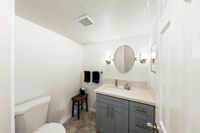 541 Camino Del Mar, Del Mar, CA 92014 - half bath featuring vanity, visible vents, a textured ceiling, and toilet