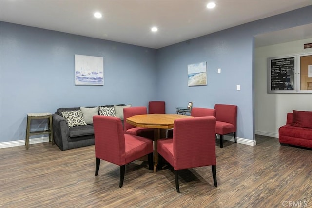 dining area featuring dark hardwood / wood-style floors