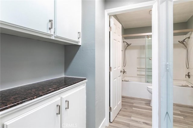 laundry room with light wood-type flooring