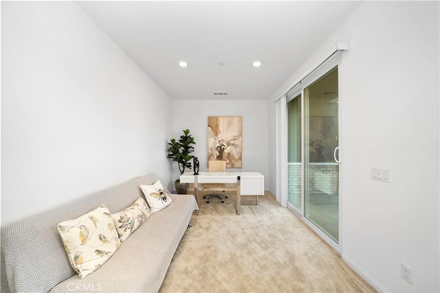 living area with light colored carpet